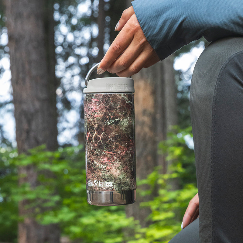 12oz-tkwide-with-twist-cap-mossy-oak-d0 12oz_tumbler_mossyoak_rainbowtrout_hand_closeup_square.jpg