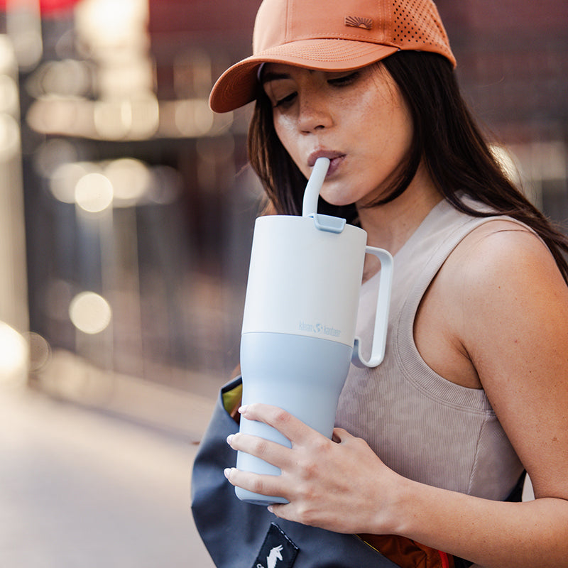 36oz-rise-tumbler-with-straw-lid-y9 36oz_rise_tumbler_straw_girl_sip_square.jpg