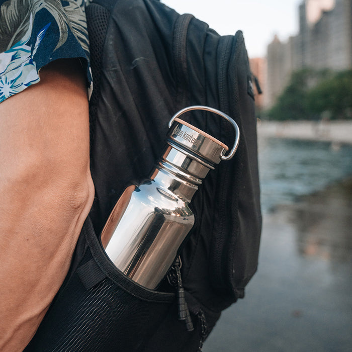 27oz-reflect-with-bamboo-cap-k5 K27SSLRF-MS-BAMBOO_reflect-bottle_backpack_lifestyle.jpg